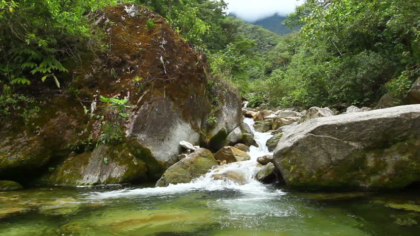 River flowing through the Ecuadorian rainforest, Ruta de las cascadas, Banos de