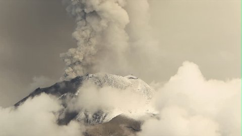 Tungurahua volcano in Ecuador, high presure gases and ash is blown into the sky.