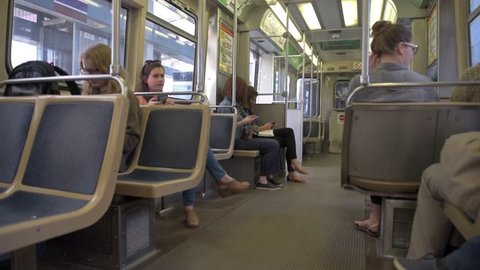 CHICAGO, ILLINOIS - APRIL 17, 2016: Chicago Metro Line. People Sitting Inside