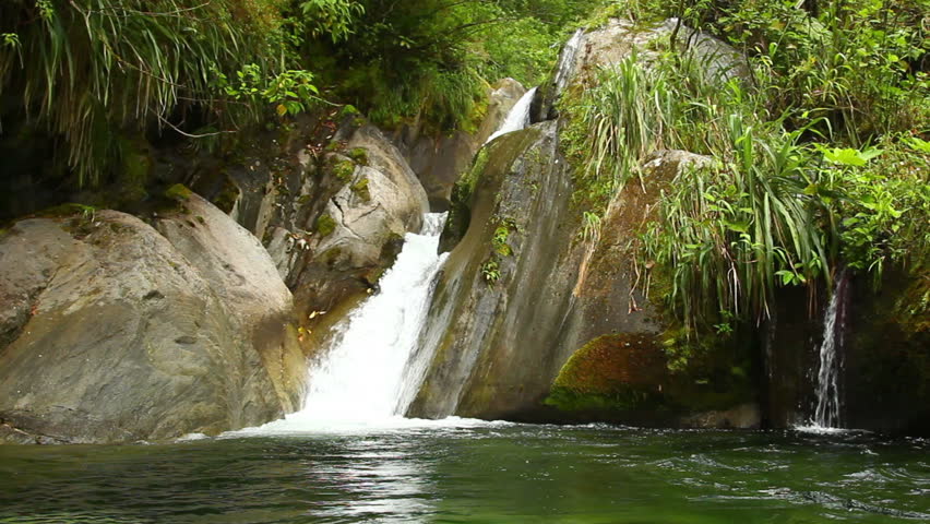 Smal waterfall in Ecuadorian cloudforest, shot from the water level