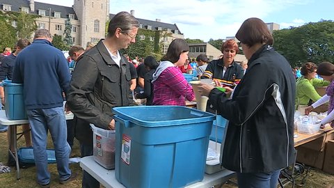 Guelph, Ontario, Canada September 2014 Students Volunteers pack charity food aid for homeless and starving in Africa