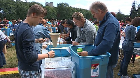 Guelph, Ontario, Canada September 2014 Students Volunteers pack charity food aid for homeless and starving in Africa
