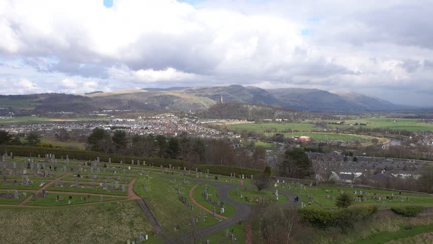 Aerial view of city of Stirling and The Wallace Monument (The National Wallace Monument) on the summit of Abbey Craig hill, Stirling, Scotland. Seen from Stirling Castle.