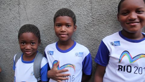 RIO DE JANEIRO, BRAZIL - CIRCA JUNE 2011: Brazilian kids smile at the camera circa June 2011 in Rio de Janeiro. Adlı Haber Amaçlı Stok Video