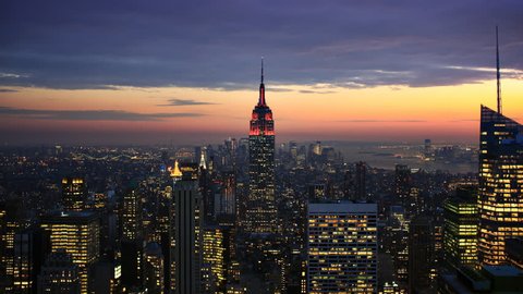Timelapse of dusk to night falling over New York City and the Empire State Building Stock Video