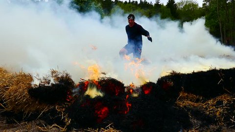 STOCKHOLM, SWEDEN, MAY 2016: Obstacle course racing-Tough viking 14 may 2016 in Stockholm Stadion- Preparing the fire on straw for the participants to jump through fire
