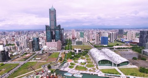 Aerial view of the city in Kaohsiung - Taiwan/Aerial shot of Tuntex Sky Tower and the exhibition center in Kaohsiung, Taiwan