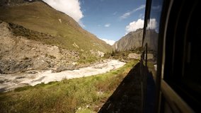 HD video footage: Driving with a train from Cusco to the Inca City Machu Picchu in a nice landscape with the river Urubamba