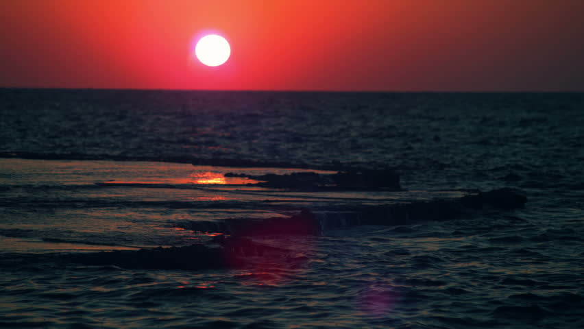 The setting sun over the Mediterranean at Dor Beach Israel.  