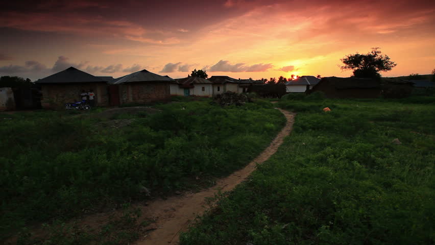 huts in Africa against a beautiful sunset