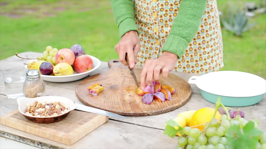 Barcelona, Spain - November 11, 2012: Woman cutting fruits outdoors | Shutterstock HD Video #16995649