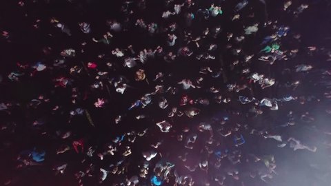 Russia, Ekaterinburg, 28 May 2016: Aerial flight above dancing, clubbing crowd on festival. Crowd of people dancing, having fun, clubbing hard at the party. People partying on a outdoors music concert