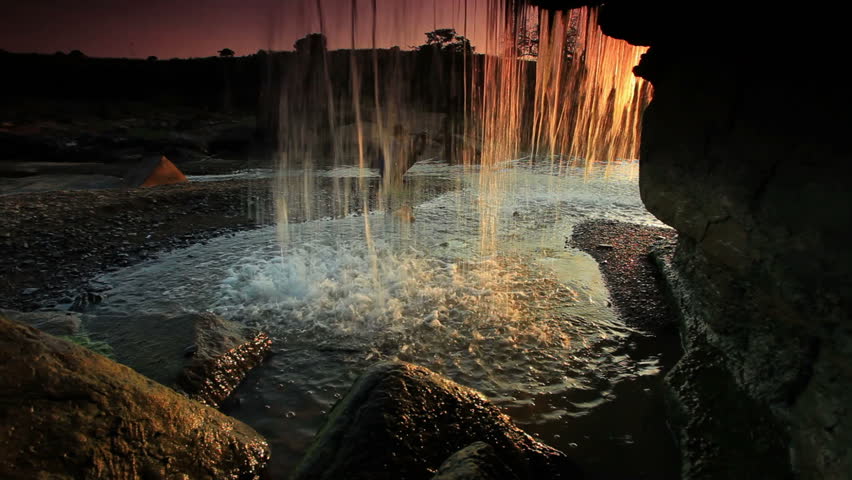 Inside shot of a waterfall at sunset in Kenya, Africa.