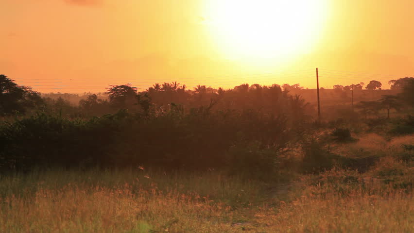 Sunset over a field near a village in Kenya two hours north of the Africa city