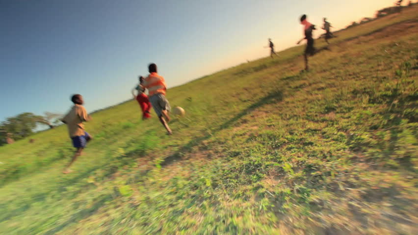 KENYA, AFRICA - CIRCA AUGUST 2010: Shot of children playing soccer on the fields
