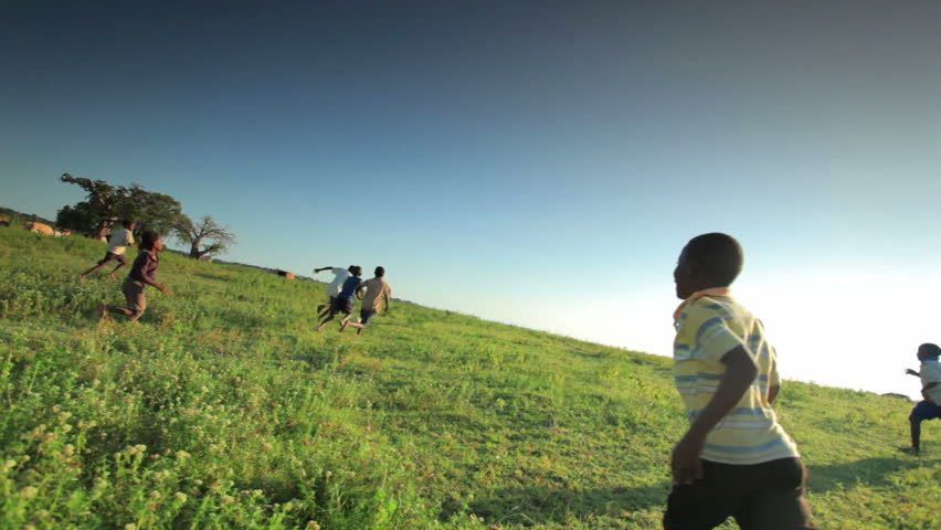KENYA, AFRICA - CIRCA AUGUST 2010: Children playing soccer on the fields in