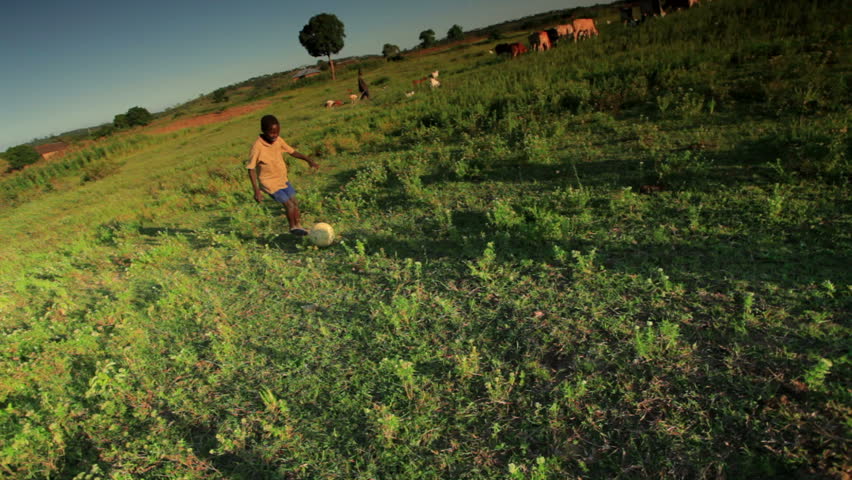 KENYA, AFRICA - CIRCA AUGUST 2010: Shot of children playing soccer on the fields
