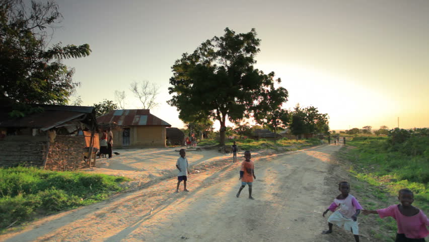 KENYA, AFRICA - CIRCA AUGUST 2010: Shot of children playing in the dirt roads in