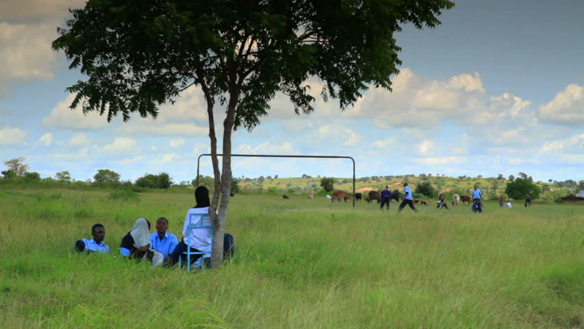KENYA, AFRICA - CIRCA AUGUST 2010: Students and workers taking a break from