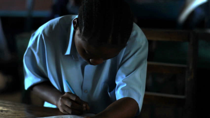 KENYA, AFRICA - CIRCA AUGUST 2010: Students taking a test in class in a school