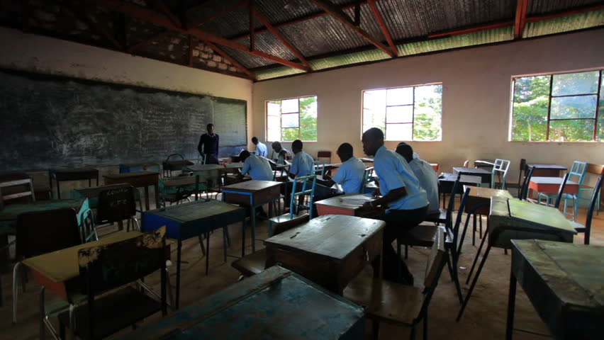 KENYA, AFRICA - CIRCA AUGUST 2010: Students taking a test in class in a school