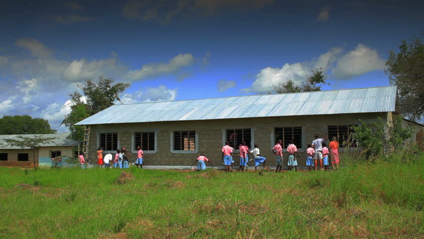 Painting the exterior of a school in a village in Kenya two hours north of the
