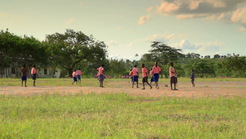 KENYA, AFRICA - CIRCA AUGUST 2010: Boys playing during recess near a village in
