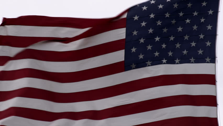 Close up of the United States flag waving in the breeze.