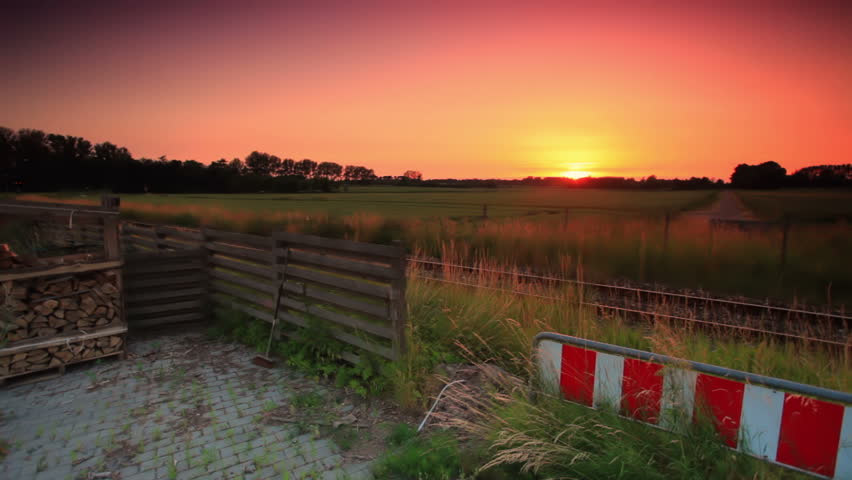 Still shot of sunset over a field in Copenhagen, Denmark