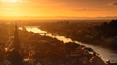 Heidelberg, Germany, timelapse video of the romantic aerial view at sunset and dusk, with the lights of the city and the Neckar river 