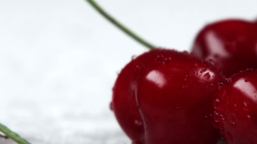 Close shot panning across red cherries.