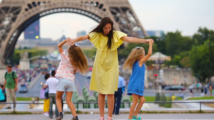 Happy family in Paris near Eiffel tower. French summer holidays, travel and people concept. | Shutterstock HD Video #17026528