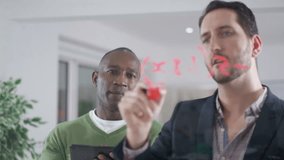4K Businessmen brainstorming for ideas, writing math formula on glass screen. Shot on RED Epic. UK - April, 2016 - Powered by Shutterstock - Get 15% off with code: PIKWIZARD15