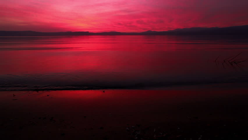 Beautiful shot at shore level at sunset shooting across Lake Tiberius/Sea of