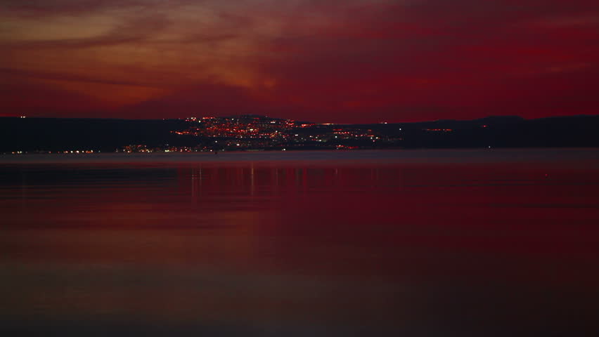 Shot of the lights of Tiberius, Israel at night across the Sea Of Galilee.