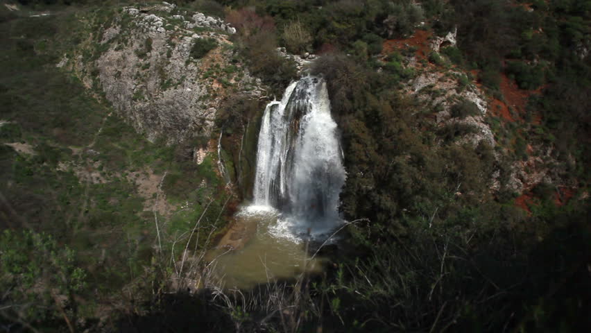 Extreme wide shot of the Tahana Waterfall near Metula, Israel, near the border