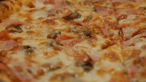 Details of Italian pizza surface tasty junk food 4K 2160p 30fps UltraHD tilting footage - Slow tilt over decorated pizza texture baked and served 4K 3840X2160 UHD video