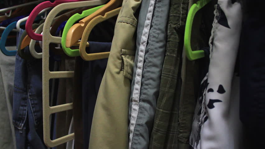 clothing inside a closet, on hangers
