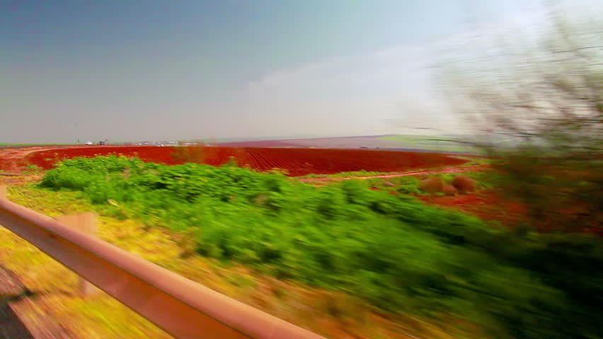 Drive-by in the Ein Harod farmland region of Israel. Shot contains a newly