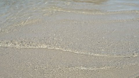Soft wave of sea on sandy beach. Background. soft focus
