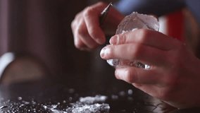 Bartender mannually crushed ice with wooden metal knife. - Powered by Shutterstock - Get 15% off with code: PIKWIZARD15