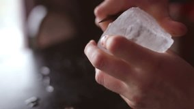 Bartender mannually crushed ice with wooden metal knife. - Powered by Shutterstock - Get 15% off with code: PIKWIZARD15