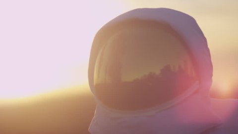 Стоковое видео: 4K Astronaut on strange planet looking for signs of life. Shot on RED Epic. UK - April, 2016