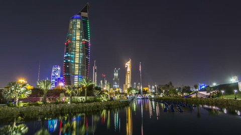 Music fountains in park with Kuwait City cityscape night timelapse hyperlapse