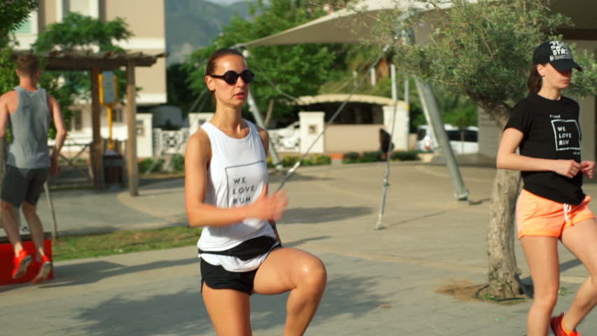 group work out in the street slow motion