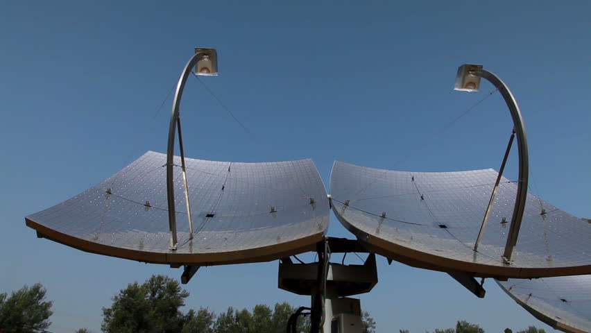 Slider dolly move left to right at a low angle of two solar panels at the Zenith