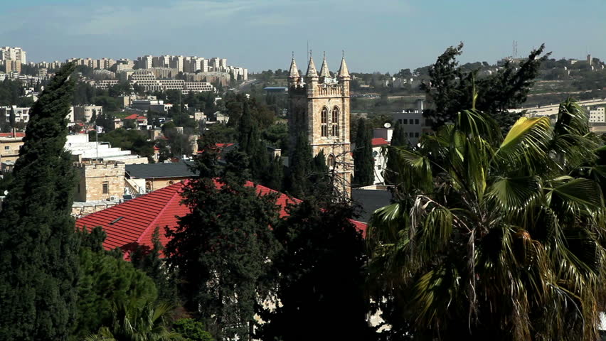 Modern business skyline of Jerusalem can be seen in the far background framed by