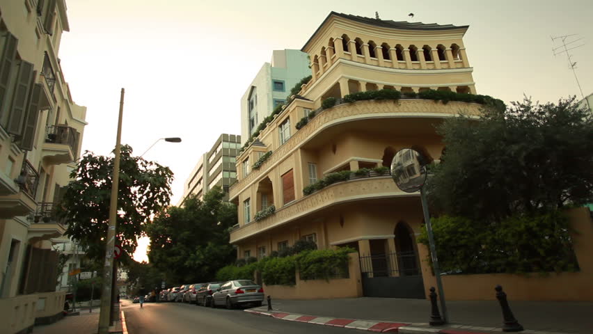 Slow slider dolly move of a Tel Aviv, Israel street, shot at twilight with the