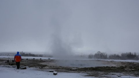 Slowmotion of Geyser Strokkur eruption in Iceland in winter on a cloudy day
