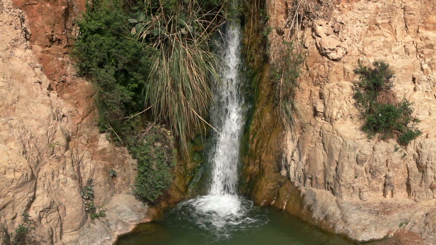 Wide angled shot of a waterfall from the Ein Gedi Nature Reserve in Israel